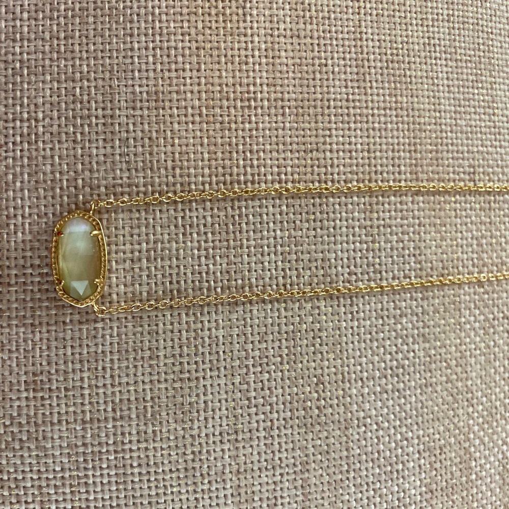 Rose gold necklace with rose gold like stone.